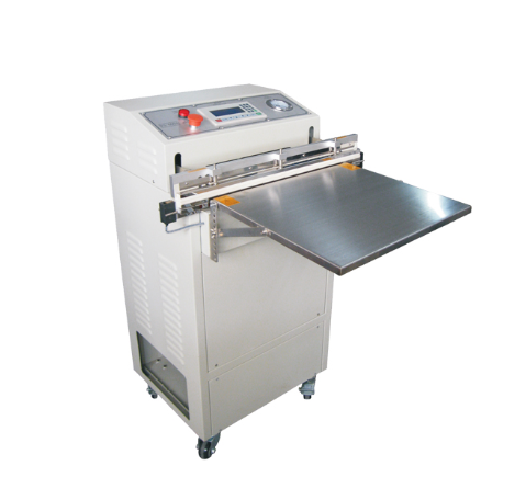 Industrial vacuum packaging machine used for sealing and air removal in production packing lines